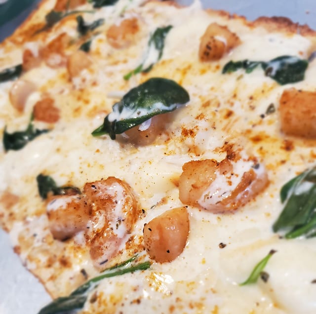 Blackened Seafood Alfredo Pizza.